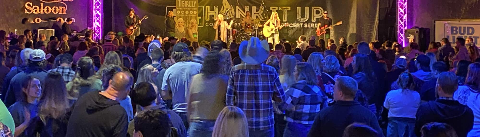country concert with fans wearing cowboy hats Cincinnati